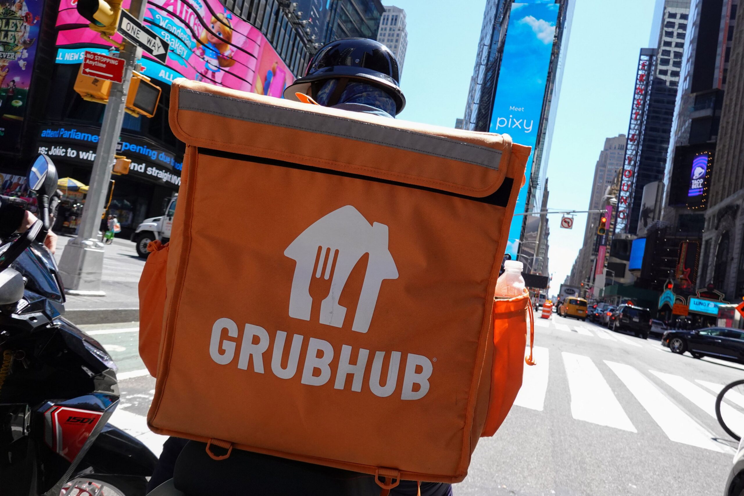 A Grubhub delivery person rides in Manhattan, New York City